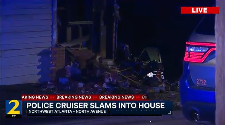 An Atlanta police officer, en route to a call for help from another officer, crashed into the back of a house near the Bankhead neighborhood late Monday. (Channel 2 Action News)