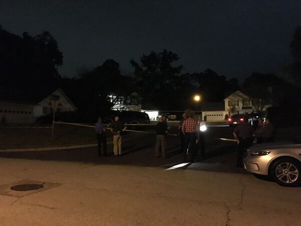 Gwinnett County police and GBI investigators work the scene of an officer-involved shooting on Alex Lane near Lawrenceville. (Credit: Gwinnett County Police Department)