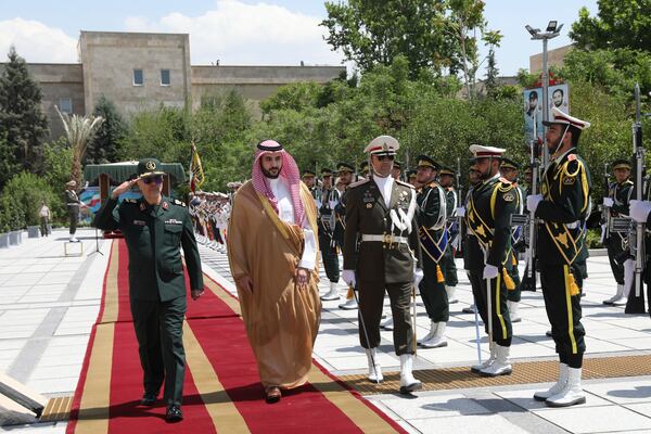 This image released by the public relations of the General Staff of Iran's Armed Forces, Saudi Arabia's Defense Minister Prince Khalid bin Salman, second left, reviews an honor guard as he is accompanied by Chief of the General Staff of Iran's Armed Forces Gen. Mohammad Hossein Bagheri, left, during a welcoming ceremony in Tehran, Thursday, April 17, 2025. ( Public relations of the General Staff of Iran's Armed Forces via AP)