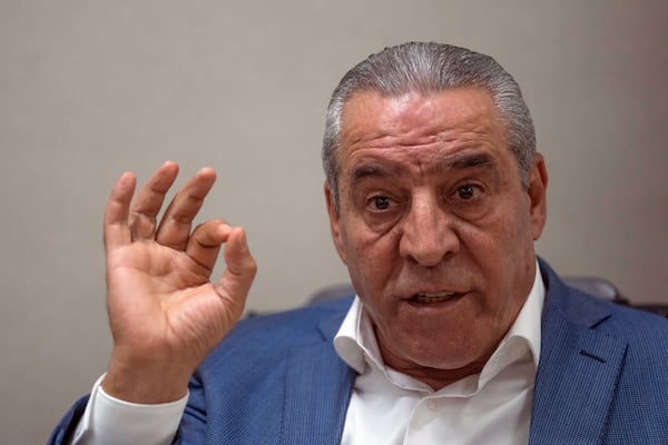 FILE - Hussein al-Sheikh, secretary-general of the Executive Committee of the Palestine Liberation Organization, gestures during an interview with The Associate Press at his office in the West Bank city of Ramallah, June 13, 2022. (AP Photo/Nasser Nasser, File)