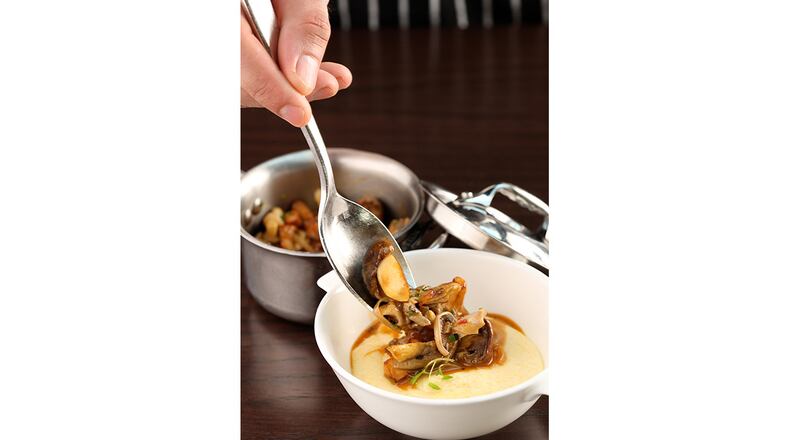 Scott Conant described his polenta cremosa at the Americano as an “elevated take on a mushroom gravy.” Courtesy of Haute Life