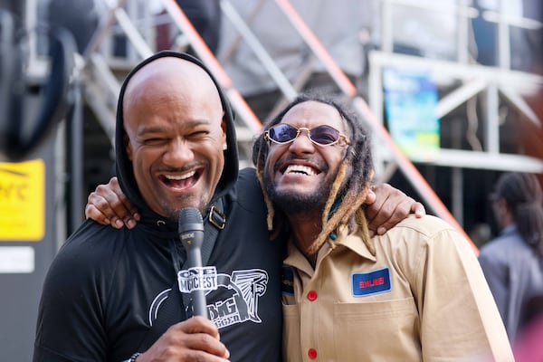 Big Tigger (left) — pictured with singer Elmiene at One Musicfest in 2024 — arrested June 20 after Sandy Springs police investigated a May 9 incident with his wife, Alicia Brown, at Tigger’s home. (Miguel Martinez/AJC)