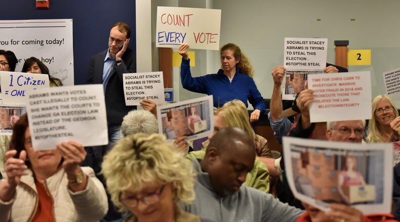 Groups on both sides of the voter access issue crowded into the Gwinnett County Board of Elections meeting on Tuesday afternoon. HYOSUB SHIN / HSHIN@AJC.COM