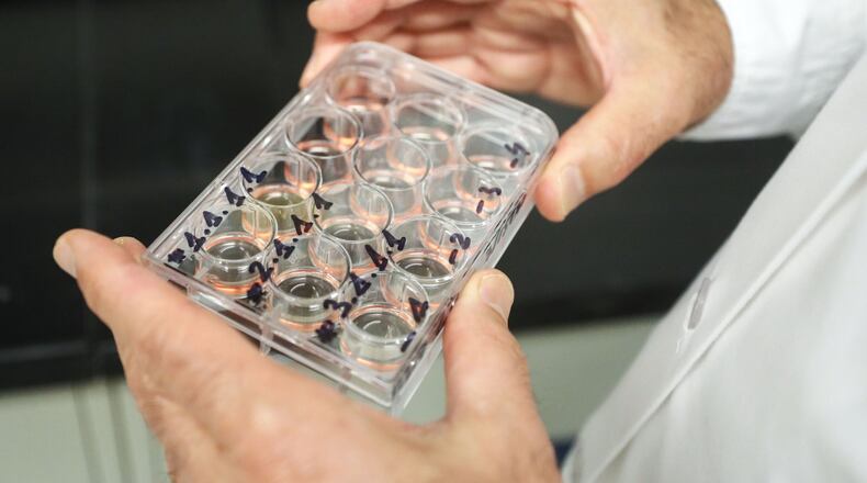 A scientist at Smyrna-based GeoVax checks a vaccine prospect for COVID-19. University labs supported by the Georgia Research Alliance are also seeking coronavirus remedies. BOB ANDRES / ROBERT.ANDRES@AJC.COM