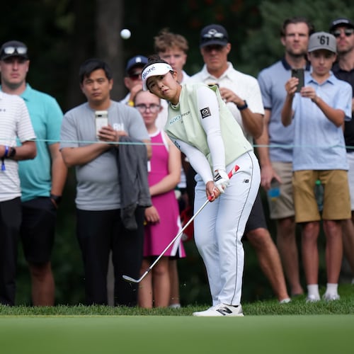Miyu Yamashita, of Japan, chips onto the 14th green with her third shot during the final round at the LPGA Canadian Women's Open golf tournament in Edmonton, Alberta, Sunday, Aug. 23, 2026. (Darryl Dyck/The Canadian Press via AP)
