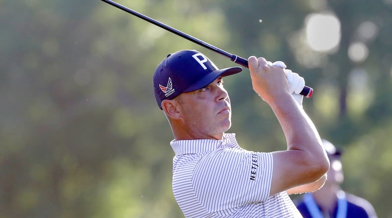 Gary Woodland watches his tee shot on the ninth hole during the first round of the Texas Children's Houston Open golf tournament Thursday, March 26, 2026, in Houston. (AP Photo/Michael Wyke)