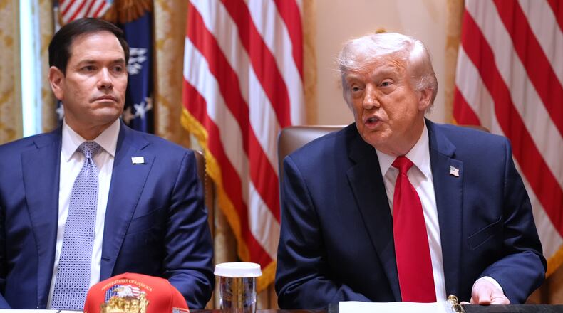 President Donald Trump, next to Secretary of State Marco Rubio, speaks during a Cabinet meeting at the White House, Wednesday, May 27, 2026, in Washington. (AP Photo/Jacquelyn Martin)