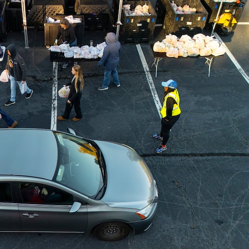 MUST Ministries delivers food to the public via a drive through service, Saturday, Nov. 1, 2025, in Austell, Ga. (AP Photo/Mike Stewart)
