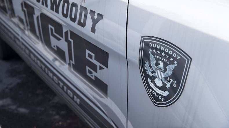 Dunwoody police cars are parked outside of the City of Dunwoody municipal building.  (Alyssa Pointer/alyssa.pointer@ajc.com)