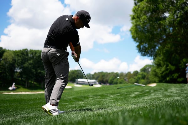 Xander Schauffele hits from the rough on the 15th hole during a practice round for the PGA Championship golf tournament at the Quail Hollow Club, Wednesday, May 14, 2025, in Charlotte, N.C. (AP Photo/George Walker IV)