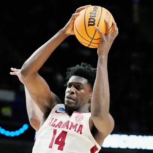 FILE - Alabama center Charles Bediako (14) pulls down a rebound while guarded by Maryland guard Ian Martinez, left, during the second half of a second-round college basketball game in the men's NCAA Tournament in Birmingham, Ala., March 18, 2023. (AP Photo/Rogelio V. Solis, File)