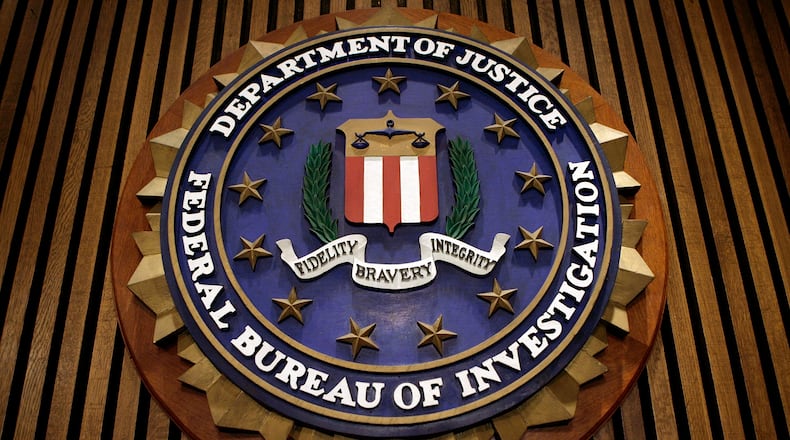 The seal of the F.B.I. hangs in the Flag Room at the bureau's headquaters March 9, 2007 in Washington, DC. (Photo by Chip Somodevilla/Getty Images)