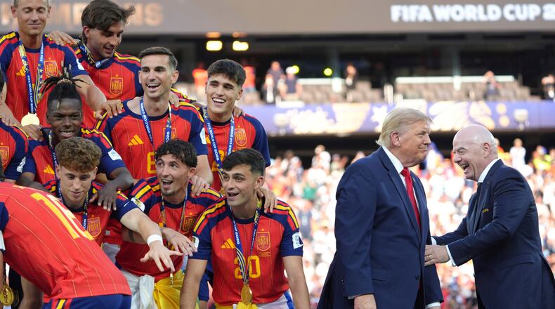 Spain players, from left, cheer alongside President Donald Trump and FIFA President Gianni Infantino at the conclusion of the World Cup championship final soccer match between Spain and Argentina in East Rutherford, N.J., Sunday, July 19, 2026. (AP Photo/Jacquelyn Martin)