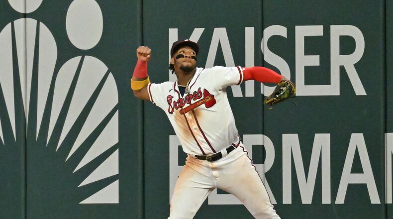 Braves right fielder Ronald Acuna Jr. celebrates after catching a fly ball by the Mets' Jeff McNeil to end game at Truist Park on Sunday, Oct. 2, 2022. Atlanta Braves won 5-3 over New York Mets. (Hyosub Shin / Hyosub.Shin@ajc.com)