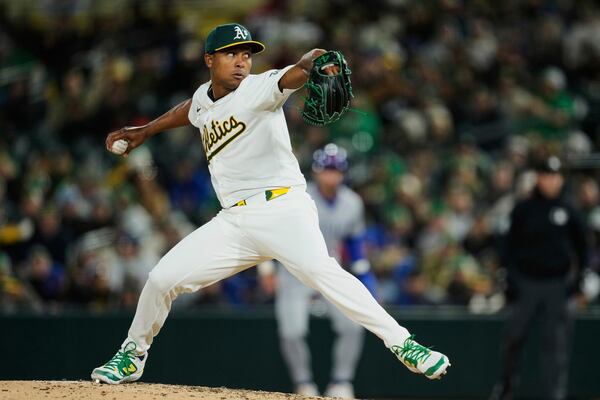 Athletics pitcher José Leclerc throws to a Chicago Cubs batter during the sixth inning of a baseball game Monday, March 31, 2025, in West Sacramento, Calif. (AP Photo/Godofredo A. Vásquez)