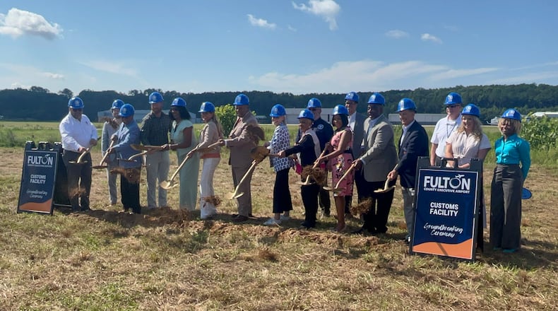 Fulton County officials gather for a groundbreaking ceremony for a customs facility at Fulton County Executive Airport on Thursday, July 9, 2026. (Carson Bonner/AJC)