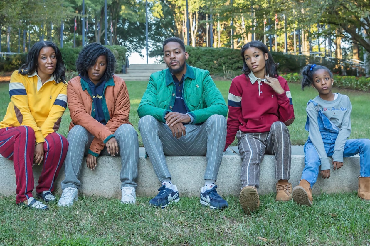 Designer Quintin Crumpler, center, and members of his family are wearing merchandise from his line, Goat by James King. Crumpler founded the Atlanta-based brand in 2018. (Contributed)