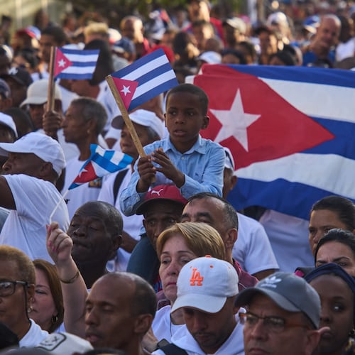 People attend a celebration marking the 65th anniversary of the proclamation declaring the Cuban Revolution socialist, in Havana, Cuba, Thursday, April 16, 2026. (AP Photo/Ramon Espinosa)