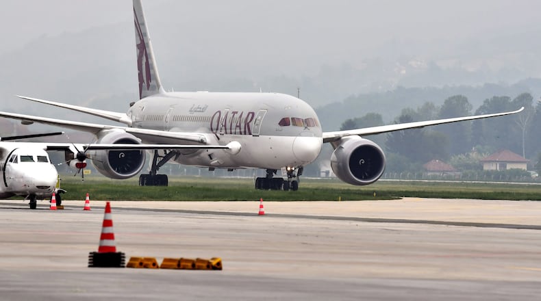 A Qatar Airways Boeing 787 airplane transporting medical protective gear donated by the government of Qatar, lands at Sarajevo International Airport on May 19, 2020, in Sarajevo, Bosnia and Herzegovina. (Elvis Barukcic/AFP/Getty Images/TNS)