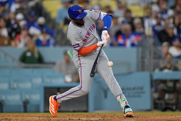 New York Mets' Ronny Mauricio grounds into a double play during the second inning of a baseball game against the Los Angeles Dodgers, Tuesday, June 3, 2025, in Los Angeles. (AP Photo/Jayne Kamin-Oncea)
