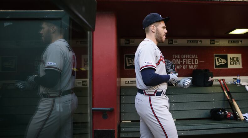 Braves first baseman Freddie Freeman walks through the dugout May 10, 2019, at Chase Field in Phoenix.