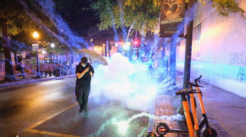 Protesters and police face off in downtown Atlanta Tuesday evening, Aug. 25, 2020.
BEN GRAY FOR THE ATLANTA JOURNAL-CONSTITUTION
