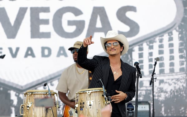 Bruno Mars performs for fans in Toshiba Plaza after a parade down the Las Vegas Strip during "Bruno Mars Day" on Friday, April 10, 2026, in Las Vegas. (Steve Marcus/Las Vegas Sun via AP)