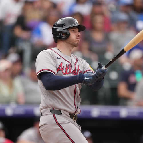Atlanta Braves' Jonah Heim follows the flight of his double to drive in two runs off Colorado Rockies relief pitcher Jimmy Herget in the ninth inning of a baseball game, Sunday, May 3, 2026, in Denver. (AP Photo/David Zalubowski)