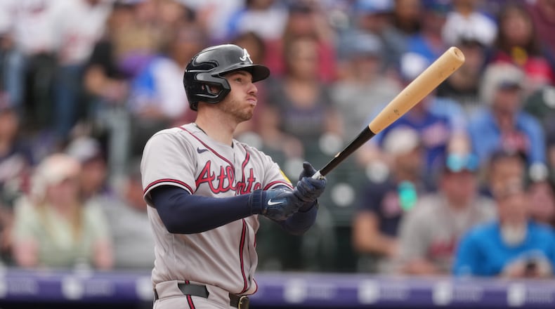 Atlanta Braves' Jonah Heim follows the flight of his double to drive in two runs off Colorado Rockies relief pitcher Jimmy Herget in the ninth inning of a baseball game, Sunday, May 3, 2026, in Denver. (AP Photo/David Zalubowski)