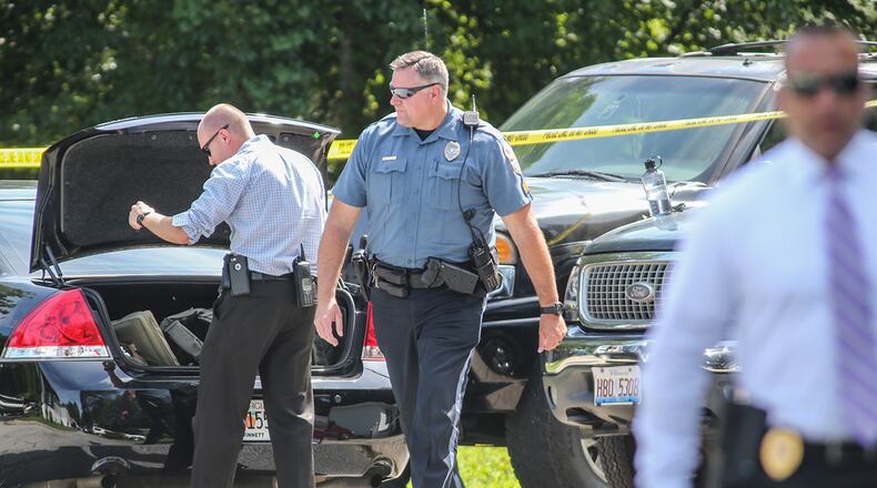 Investigators work at the home where four children and their father were stabbed to death on July 6, 2017 on Emory Lane in Loganville. A fifth child was hospitalized with serious injuries. (John Spink / jspink@ajc.com)