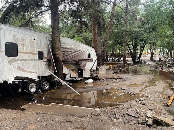 In this photo provided by Jean Meairs, damage from a flood that tore through the Riverview RV Park along the Rio Ruidoso is seen, Tuesday, July 8, 2025, in Ruidoso, N.M. (Jean Meairs via AP)