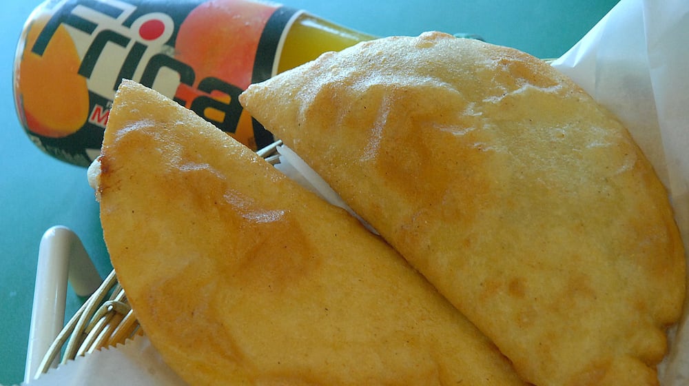 When dining at the Natarica Grill Venezuelan restaurant in Norcross, it’s always a good idea to order some cheese-filled empanadas. AJC FILE