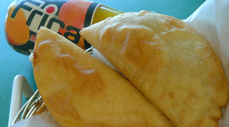When dining at the Natarica Grill Venezuelan restaurant in Norcross, it’s always a good idea to order some cheese-filled empanadas. AJC FILE