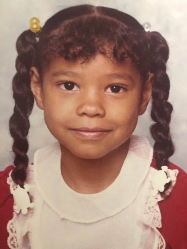 “We lived in a predominantly Black neighborhood, but we always understood both worlds,” says Kristy Reese, shown here in elementary school. (Courtesy of Kristy Reese and Kimberly Gibbs)