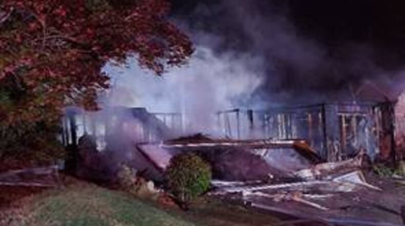 Neighbors kicked down a fence to help the grandfather and grandchildren escape the fire.