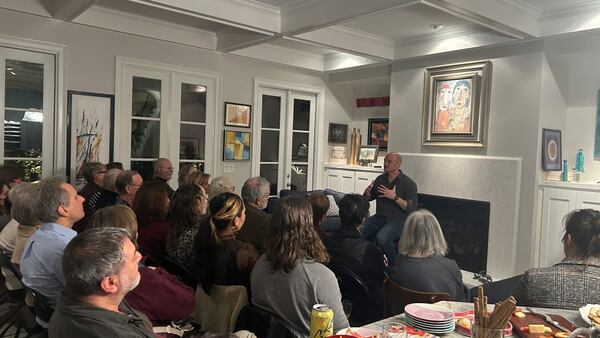 Playwright and actor Lee Osorio performs 'Prisontown' on opening night of Out of Hand Theater's Shows in Homes program, which performs plays in intimate settings, on Jan. 29, 2026. (Courtesy of Naya West)