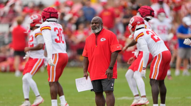 Kansas City Chiefs offensive coordinator Eric Bieniemy watches NFL football training camp Tuesday, Aug. 11, 2026, in St. Joseph, Mo. (AP Photo/Charlie Riedel)