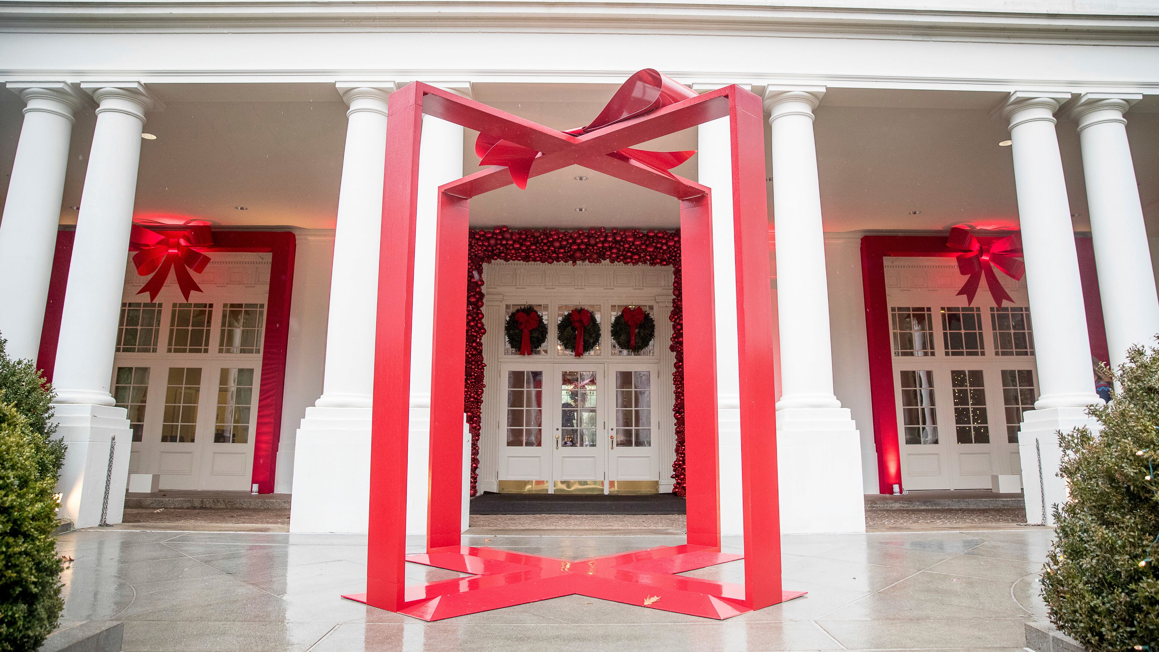 FILE - A large ribbon is displayed outside the East Wing of the White House during a preview of the 2016 holiday decor, Nov. 29, 2016, in Washington. (AP Photo/Andrew Harnik, File)