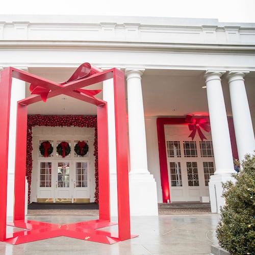 FILE - A large ribbon is displayed outside the East Wing of the White House during a preview of the 2016 holiday decor, Nov. 29, 2016, in Washington. (AP Photo/Andrew Harnik, File)