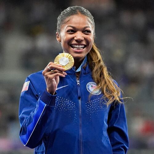 FILE - Gold medalist Gabby Thomas stands on the podium after the women's 200-meter at the 2024 Summer Olympics, Wednesday, Aug. 7, 2024, in Saint-Denis, France. (AP Photo/Matthias Schrade, File)