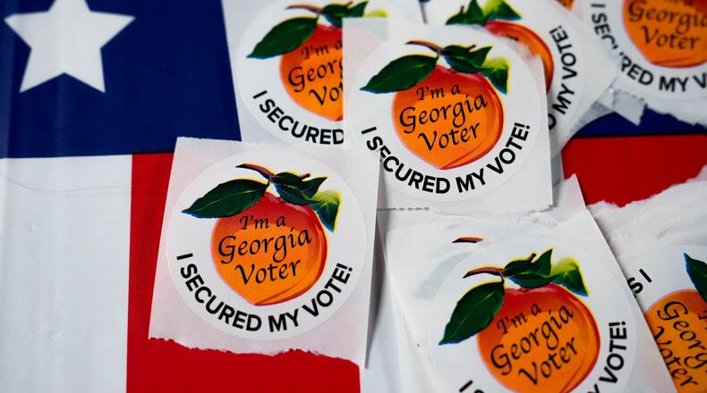 FILE - Stickers sit on a table inside a polling place, Nov. 5, 2024, in Atlanta. (AP Photo/Brynn Anderson, File)
