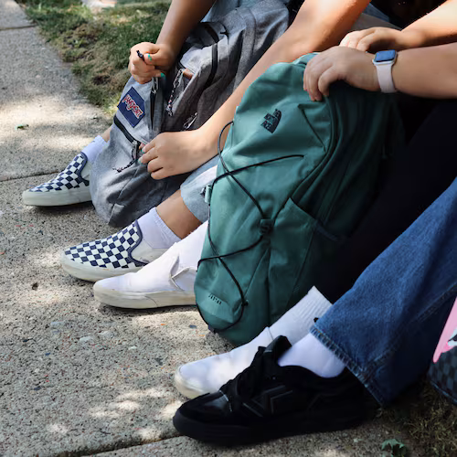 Middle school students Claire Knoth and Brockton Lozano and high school student Zoie Knoth share what is in their backpacks Friday, July 31, 2026, in Flagstaff, Ariz. (AP Photo/Cheyanne Mumphrey)