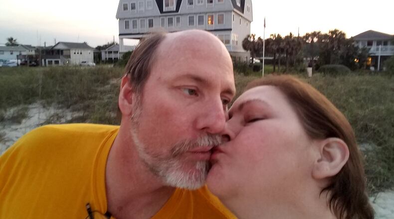 James and Mary Beck of Fayetteville share a kiss on Amelia Island. The couple smells some of the smoke from the Okefenokee wildfire but it isn’t enough to spoil their vacation.
