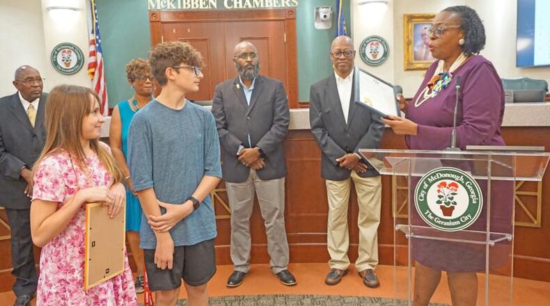 During the July 22 McDonough City Council meeting, Mayor Sandra Vincent recognizes Brantley Abbott for her life-saving efforts. (Courtesy of City of McDonough)