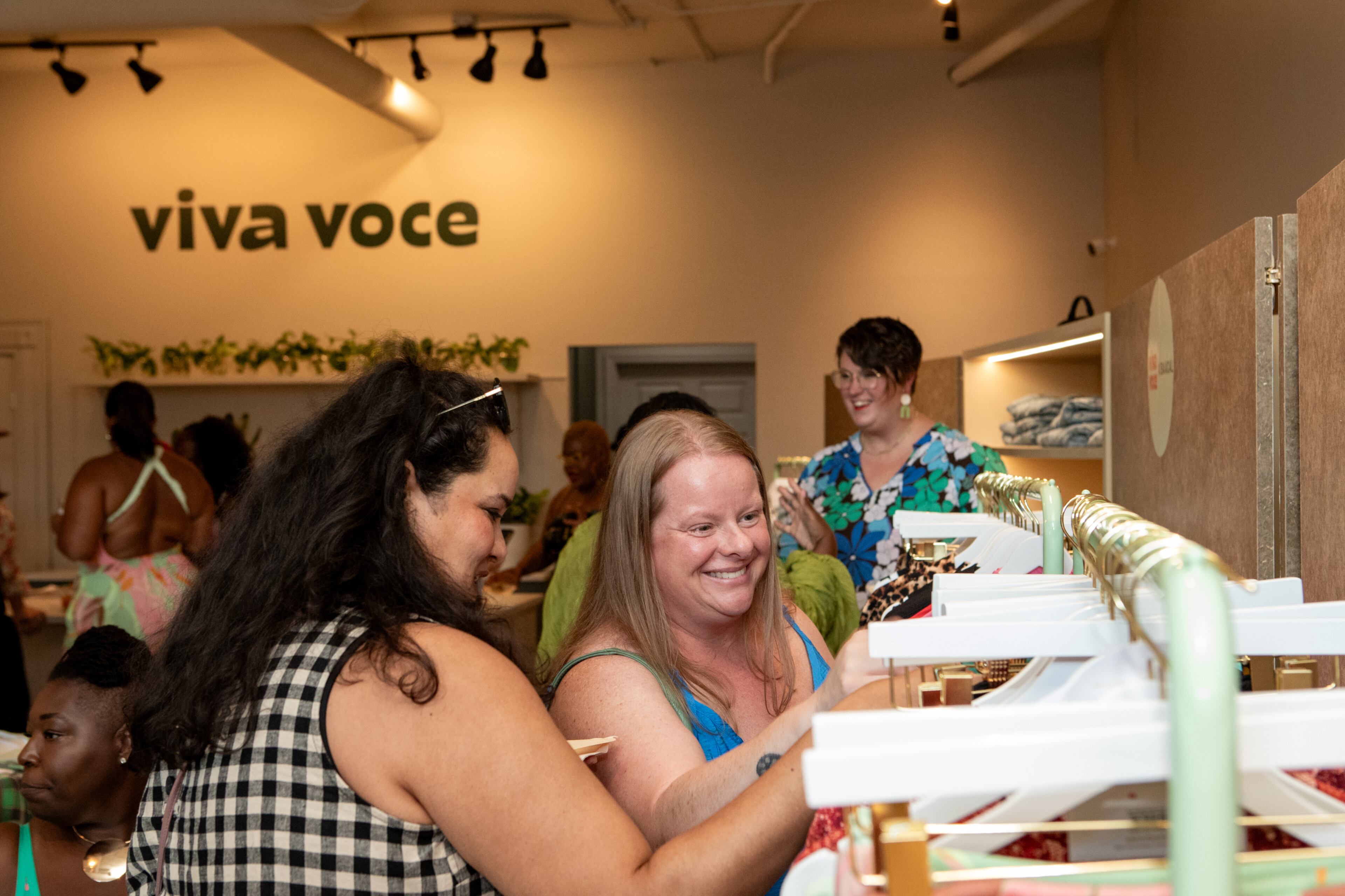 Viva Voce, a size-inclusive fashion boutique, opens its first pop-up shopping experience on Wednesday, July 30, 2025, in Inman Park, where Minnie Zarapkar, left, of Dunwoody and Shannon Holden, right, of Alpharetta gather items to try on. (Jenni Girtman for The Atlanta Journal-Constitution)