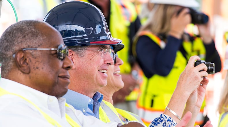 SunTrust Banks Chairman and CEO Bill Rogers joins Hank Aaron at a SunTrust Park ceremony during the construction of the stadium. (Contributed photo by Pouya Dianat/Atlanta Braves/Getty Images)