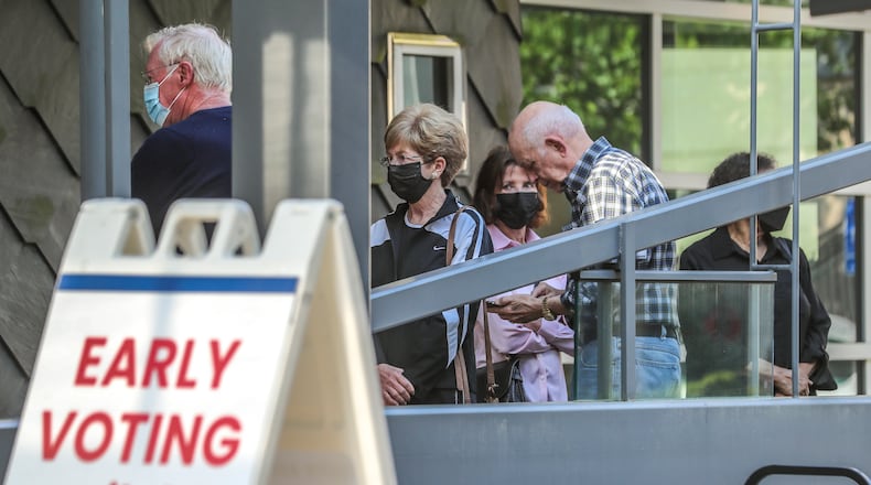 May 2, 2022 Atlanta: Voters gathered at the Buckhead Library located at 269 Buckhead Ave NE in  Atlanta for early voting on Monday May 2, 2022. Three weeks of early voting began Monday for voters who want to cast their ballots in the Georgia primary before election day on May 24. In-person early voting is usually the most popular way of participating in Georgia elections, providing at least 17 days when voters can pick a time that fits their schedule. About 54% of voters cast ballots in advance during the 2020 presidential election. The primary includes races for Georgia governor, the U.S. Senate, statewide offices and the General Assembly. Early voting locations, hours and sample ballots are available online on the state’s My Voter Page at mvp.sos.ga.gov. The primary might be the first time many voters go to the polls since the General Assembly passed Georgia’s new voting law in March 2021, though some cities held local elections in the fall. Changes to voting laws affect early voting in several ways. The minimum early voting hours are set at 9 a.m. to 5 p.m., and counties can offer up to 12 hours of daily early voting, from 7 a.m. to 7 p.m. In previous elections, early voting times were required “during normal business hours,” but those hours weren’t defined. Early voting will also be offered on two Saturdays, and local election offices have the option of providing voting hours on two Sundays as well. Before the law, one Saturday of early voting was required. Early voting is available from May 2 to May 20. All voters also have the option of casting absentee ballots in advance of election day, but the rules have changed. Under Georgia’s voting law, voters can no longer request an absentee ballot online without signing a paper form, meaning they’ll need access to a printer in most circumstances. A driver’s license or other form of ID is also required. The state’s new absentee ballot request website is securemyabsenteeballot.sos.ga.gov.
The deadline to request an absentee ballot is now 11 days before election day, on May 13 for the primary, and completed ballots must be received at local election offices before polls close. Voters can return absentee ballots through the mail or in drop boxes, but fewer ballot drop boxes are available this year, and there won’t be an option during the final days of the election. Georgia’s voting law prohibits drop boxes from being used except during early voting hours, and they can only be located inside early voting locations. The number of drop boxes in each county is capped at one for every 100,000 active voters or the number of early voting locations, whichever is lower. Every county must install at least one drop box. (John Spink / John.Spink@ajc.com)