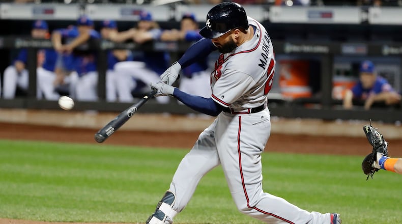 Nick Markakis hits an RBI double Tuesday at New York. He left that night to attend to a personal matter at his home outside Baltimore and rejoined the Braves for Thursday’s game at Miami. (AP Photo/Frank Franklin II)