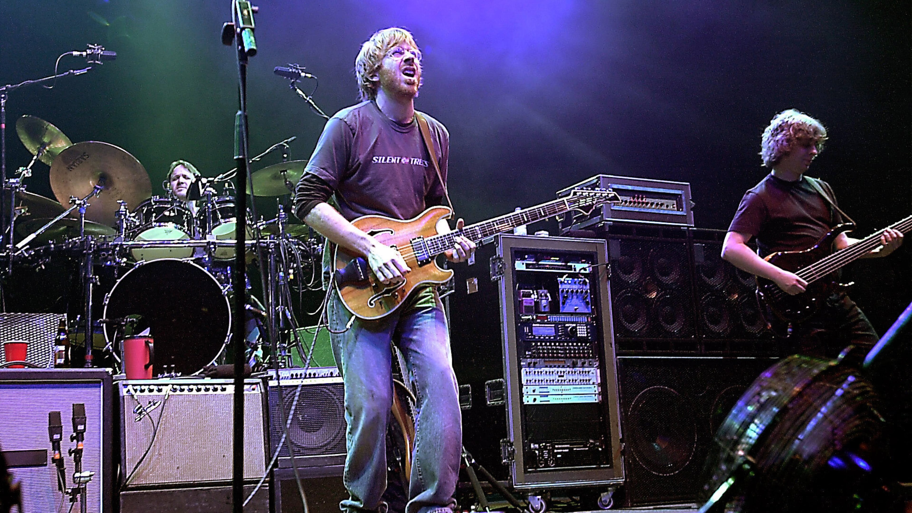 FILE - The group Phish, drummer Jon Fishman, guitarist Trey Anastasio, center, and bassist Mike Gordon, perform in this Dec. 31, 2002 file photo at New York's Madison Square Garden. (AP Photo/Stephen Chernin, File)