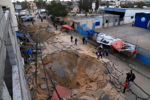 Palestinians inspect the site of an Israeli army airstrike on the European hospital in Khan Younis, Gaza Strip, Tuesday, May 13, 2025. The Israeli military said it had carried out a strike targeting what it said was a Hamas "command and control center" located beneath the hospital. (AP Photo/Mariam Dagga)